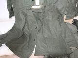 an image of a jacket and pants on a bed
