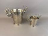 two silverplated cups with deer heads on them