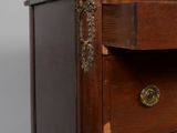 an antique wooden chest of drawers with marble top and brass hardware