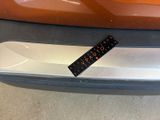 a sticker on the front bumper of a car