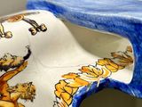 a blue and white vase with a bird design on it