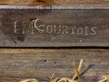 a close up of a piece of wood with writing on it