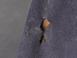 close up of a piece of fabric with a hole in it