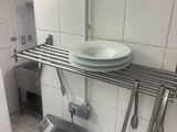 a kitchen with a sink and a mixer on the counter
