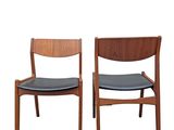 two wooden chairs with black leather seats on a white background