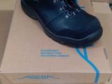 a box with a pair of black shoes on it