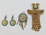 a close up of a group of jewelry on a white surface