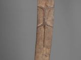 an image of a wooden sculpture of a man on a stand