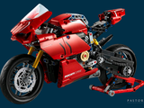 a red motorcycle that is sitting on a blue background