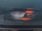a picture of a car ' s rear view mirror showing the speed of the car