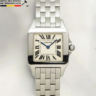 an image of a silver watch with roman numerals on the face