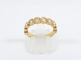 an 18k yellow gold ring set with diamonds