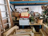 many boxes and boxes on a shelf in a room