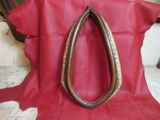 a red cowhide rug with a pair of pliers on it