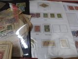 a lot of stamps on a table with a bag of them