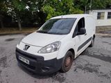a white van that is parked in a parking lot