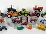 many different types of toy tractors on display