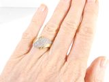 a woman ' s hand with a diamond ring on it
