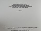 the letter is written in french on a piece of paper with a picture of a man