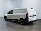 the white van is parked in the empty room of the building