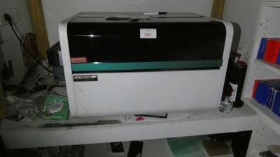 a microwave that is sitting on a shelf in a room