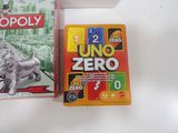 two uno - zero games on the table next to each other