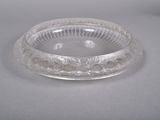 a clear glass bowl on a table with a white background