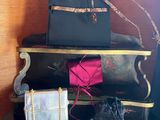 a stack of luggage sitting on top of a wooden table