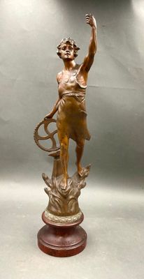 statue of a woman holding a tennis racquet on a wooden base