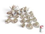 a lot of coffee cups and saucers on the table
