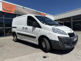 a white van parked in front of a building