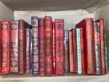 a lot of books that are sitting on a shelf