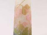 a glass vase with a floral design on it