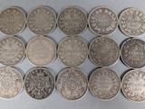 six different types of silver coins on a white surface