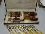 a lot of silverware in a case on a table