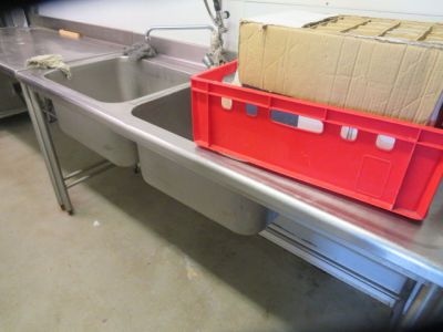 a red box sitting on top of a sink next to a red box