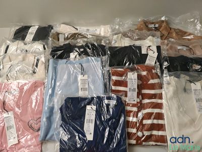 a lot of shirts that are wrapped in plastic