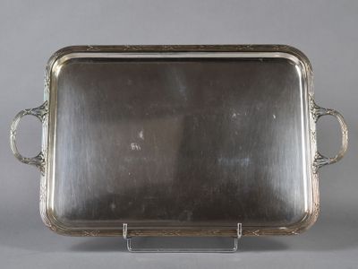 an antique silver plate with handles and handles on a stand