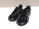 black asics running shoes on a white surface