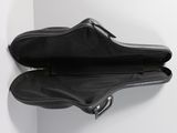 a guitar case hanging on the wall next to a wall