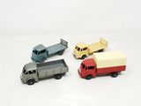 four toy cars that are sitting next to each other