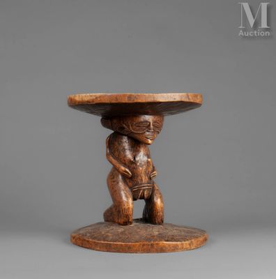 a wooden table with a monkey holding a bowl on top of it