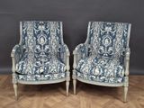 pair of blue and white upholstered chairs in the style of louis ii