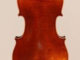 an old violin with a wooden back and a long neck