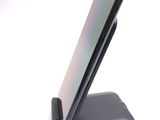 a cell phone that is sitting on top of a stand