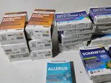several boxes of allergys sitting on top of a table next to a box of allergys