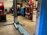 an image of a car being worked on in a garage