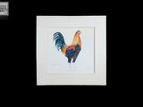 tableau représentant un coq aux couleurs vives, dans un cadre blanc, sur fond noir