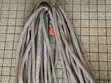 a bunch of wires on the floor next to a door