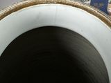 a close up of a blue and white vase on a table